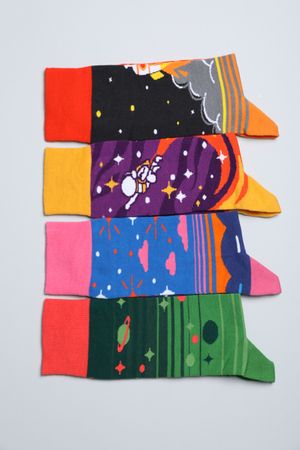 Casual clothes and wearing concept - socks, clothes for foot