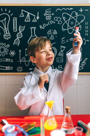 Boy playing with chemistry set