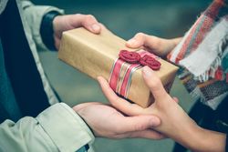 Hands exchanging a gift