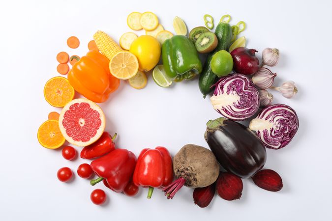 Flat lay with different vegetables and fruits on plain background, copy space