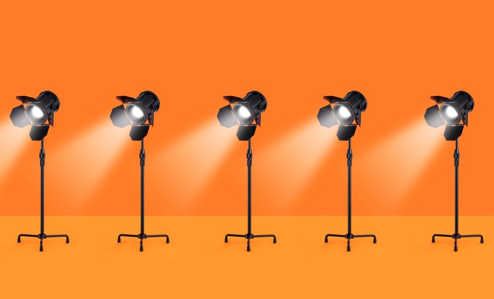 Studio lamps over orange background