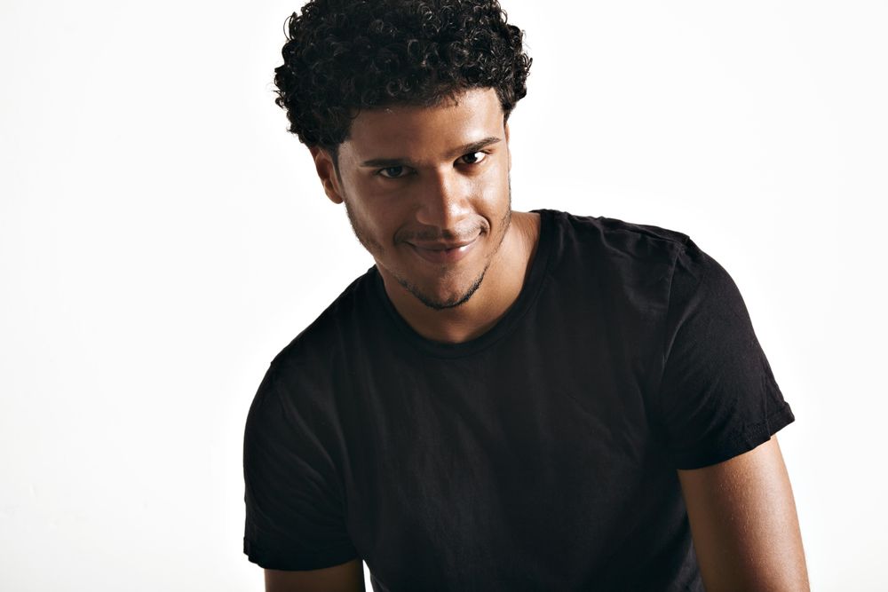 Smirking shot of male model in studio shoot