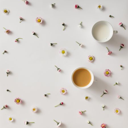 Coffee and milk on light background with colorful flower pattern