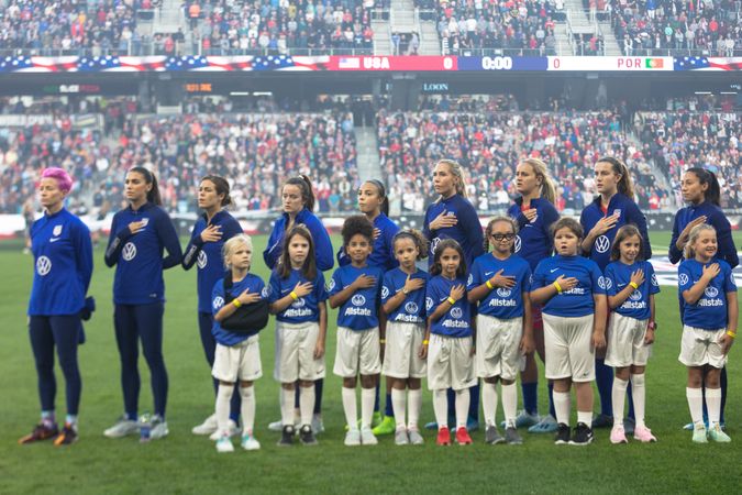 St. Paul, Minnesota, USA - Sept 3, 2019: USA Woman’s Soccer team and young players stand for anthem