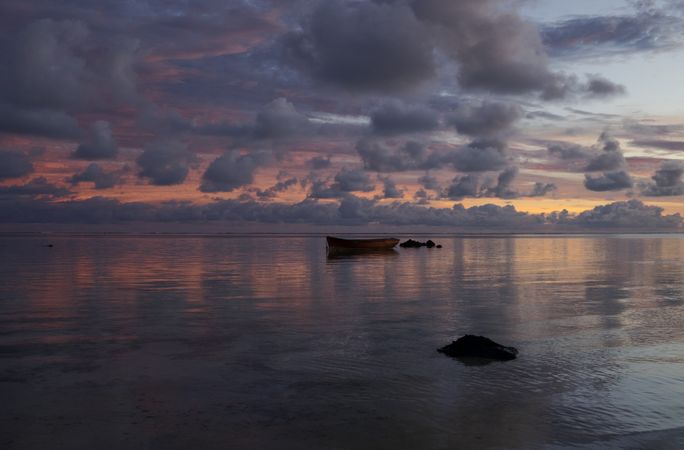 A single boat on the Indian Ocean at dawn