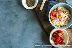 Top view of traditionally healthy breakfast with chia and strawberry with copy space 48BNM7