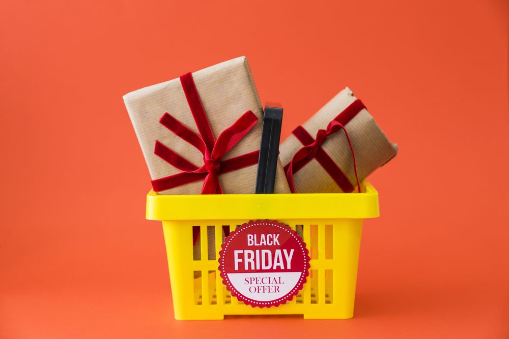 Basket of holiday sale items wrapped with a holiday bow