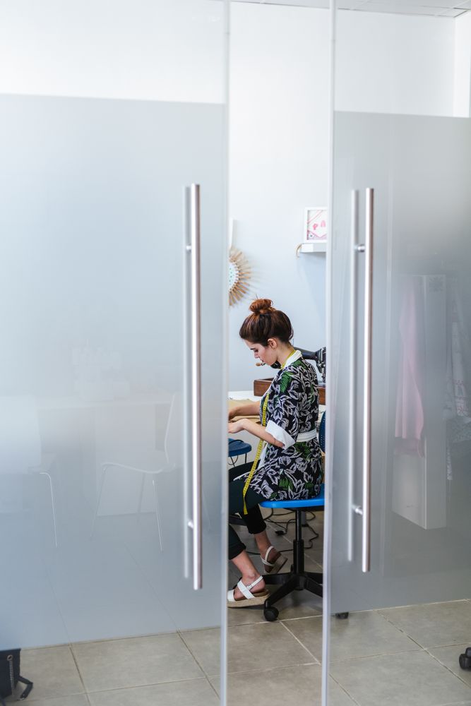 Woman in a sewing school