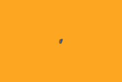 One single boat floating in orange waters