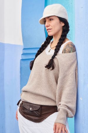 Smiling woman posing near vintage door