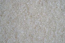 Flatlay of scattered granulated sugar