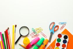 Flat lay composition with school supplies on blank background, space for text