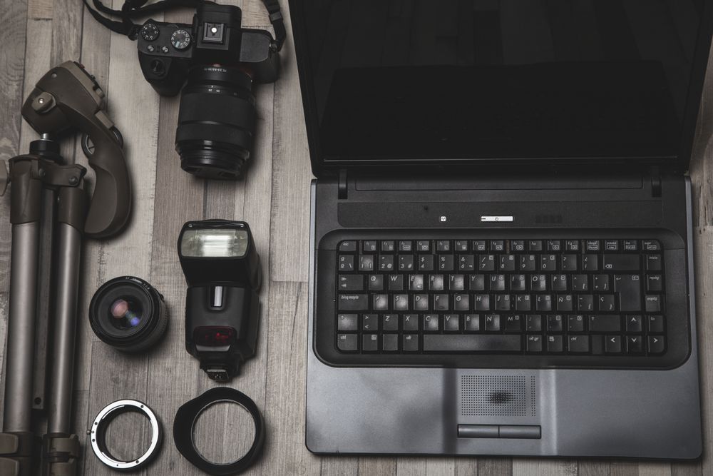 Photography equipment placed near laptop