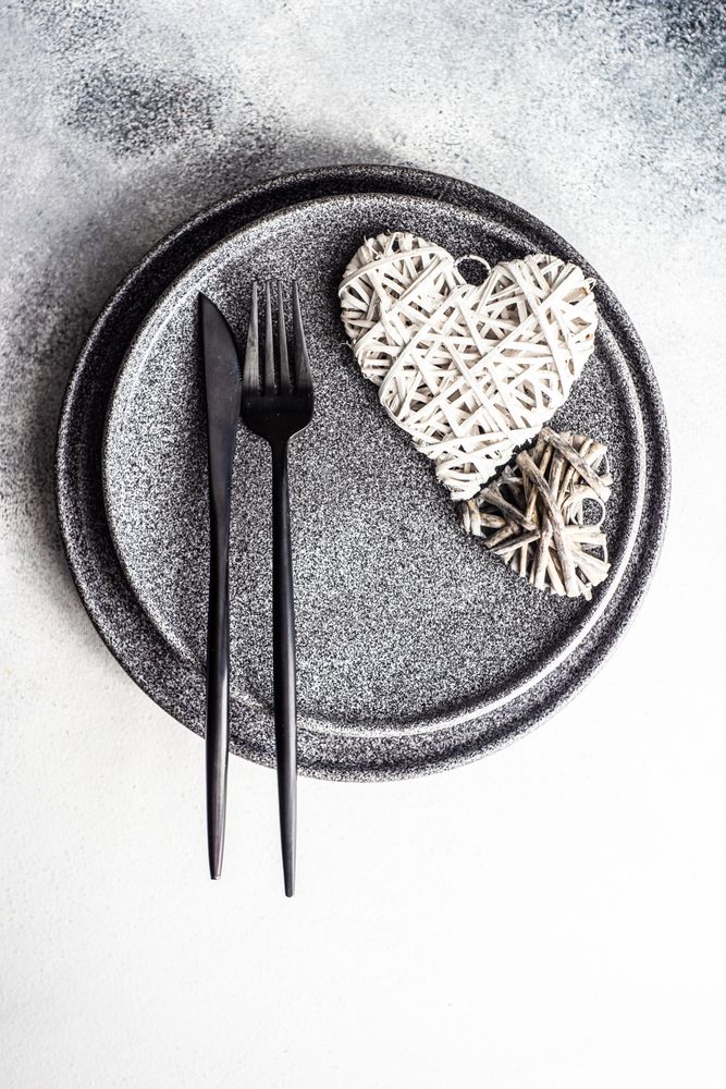 Place setting for St. Valentine Day with thatched heart decor