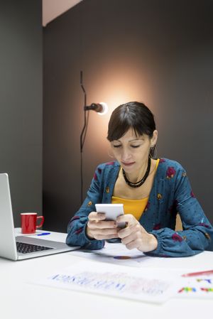 Woman working with charts in office