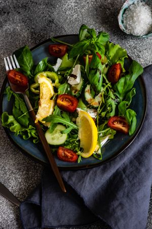 Eat green concept of salad on grey table