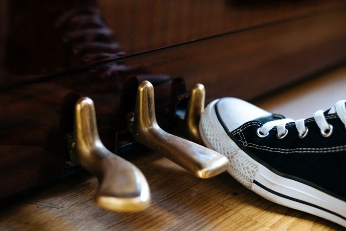 Foot on piano pedal