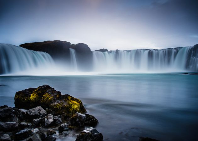 Waterfall between lands of valley