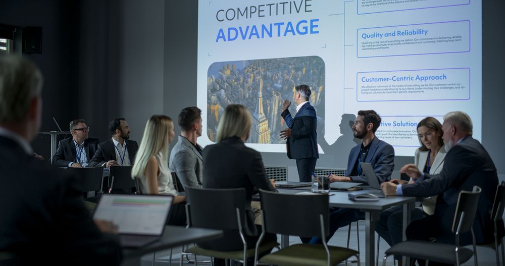Corporate Event: Male Tech CEO Giving Presentation To Colleagues, Investors In Conference Room Of Innovative Startup Company Office.