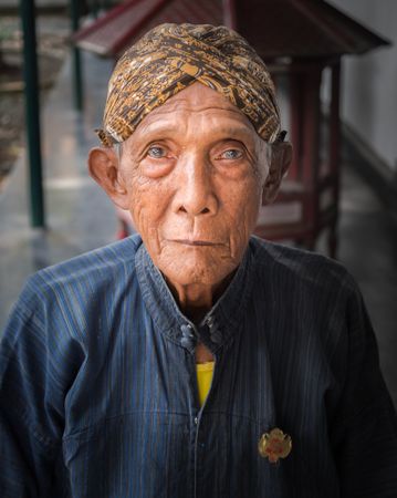 Java Island, Indonesia - August, 14 2015: Older Indonesian person looking at camera