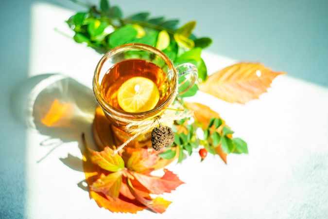 Top view of autumnal tea with lemon