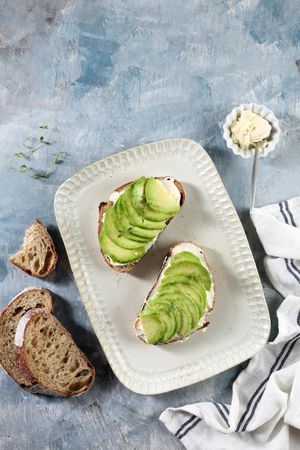 Open Sandwich Sourdough Bread with Sliced Avocado, Cream Cheese, and Honey