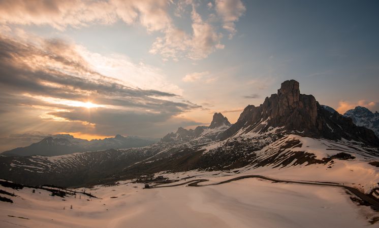 Breathtaking landscape of snowy mountains in clouds