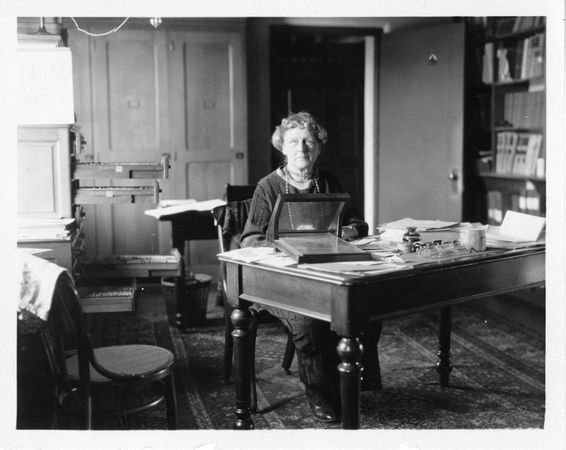 Annie Jump Cannon (1863-1941), sitting at desk in observatory