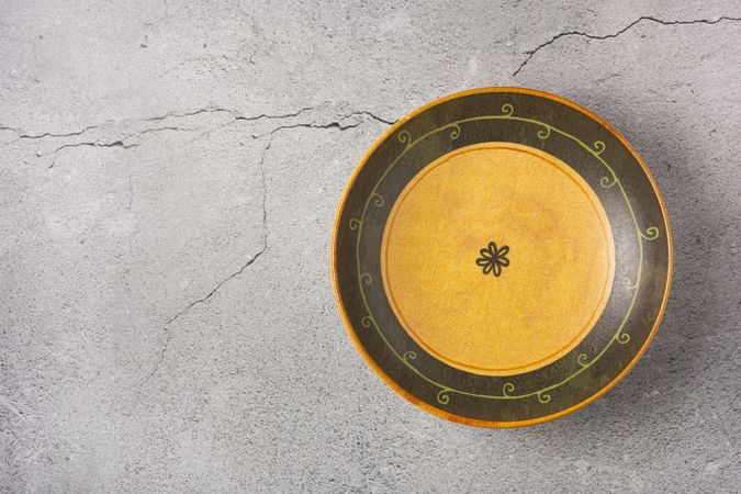 Empty plate on the slate table. Top view of the image.