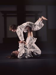 Krav Maga trainer holding boy on feet
