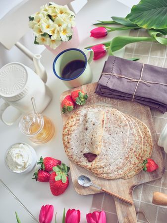 Delicious tasty homemade crepes on kitchen desk
