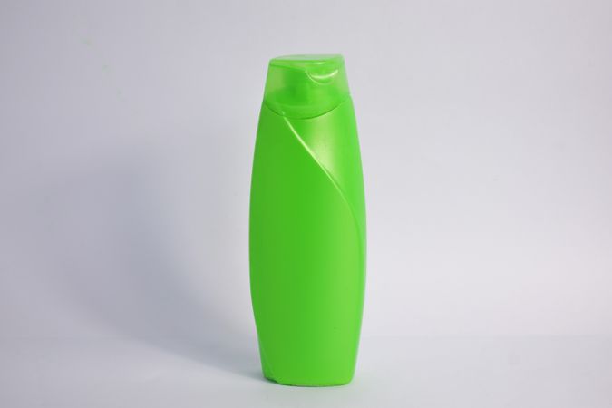 Green body wash bottle without labels and copy space