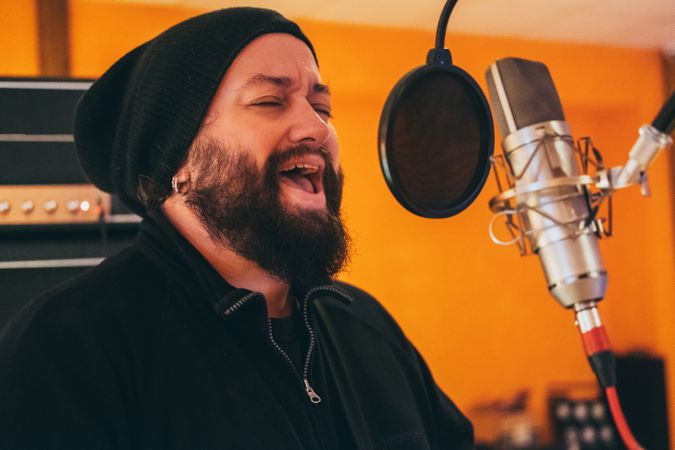 Musician playing guitar and singing