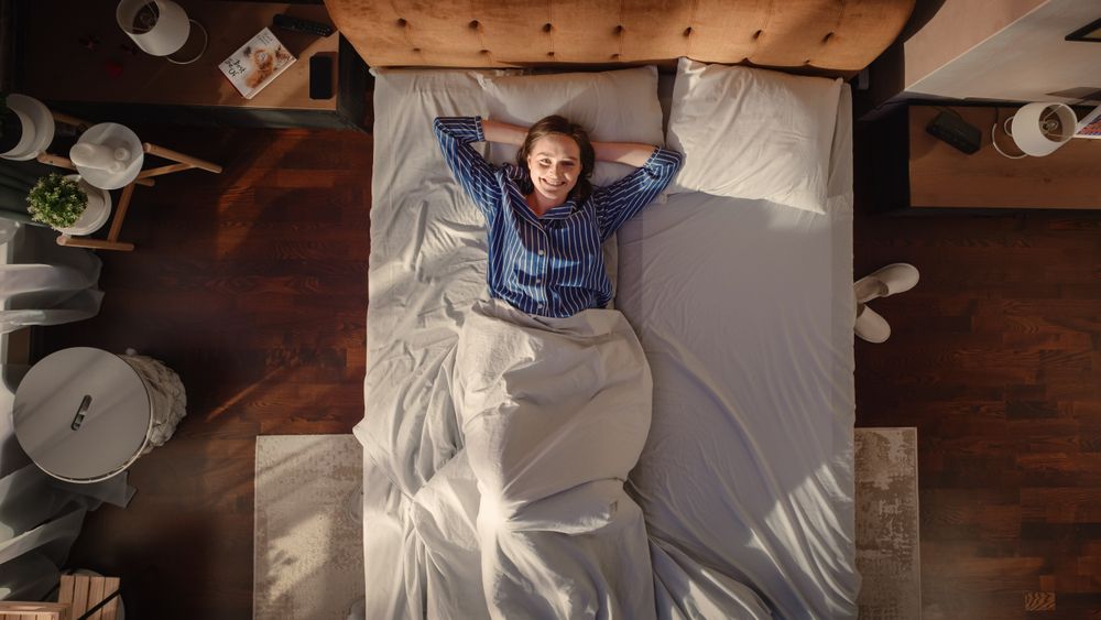Top View Apartment: Young Woman Sleeps Charmingly in Her Bed,