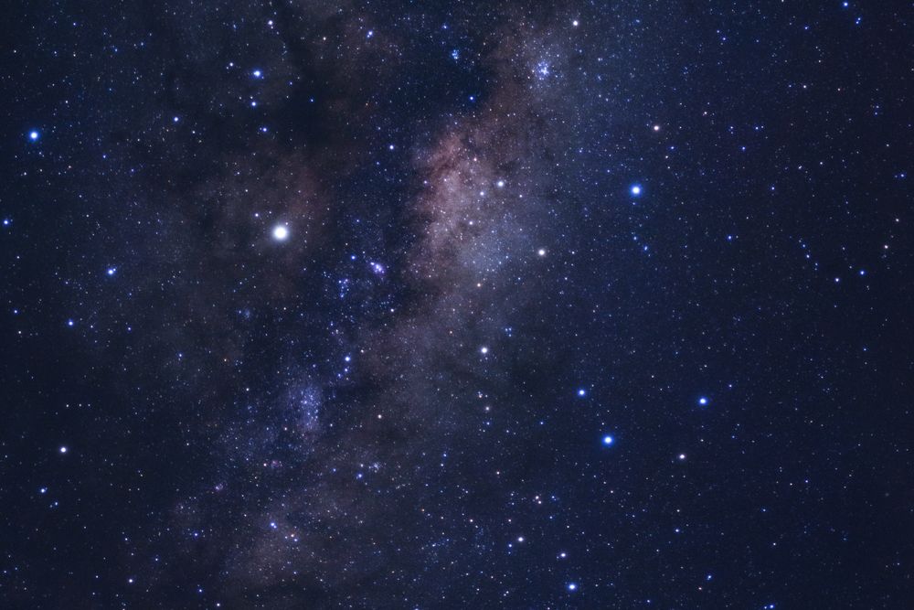 Milky way galaxy with stars and space dust in the universe, Long exposure photograph, with grain.