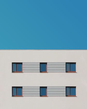 Concrete building with three symmetrical windows
