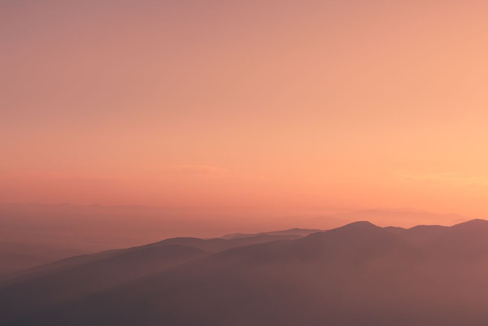 Sunset sky over mountain ridge