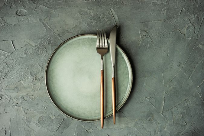 Elegant table setting with cutlery on concrete table