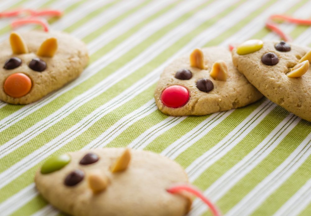 Cookies with mouse shaped and red licorice tail