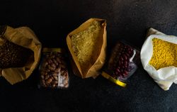 Top view of variety of dried pantry items on kitchen counter