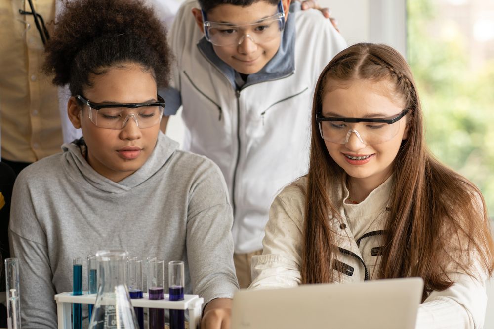 Multi-ethnic male and female students in protective eye wear