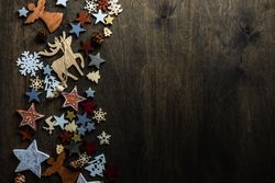 Top view of flat cut out Christmas ornaments along side of table