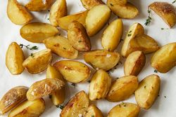 Potato wedges with thyme and salt close up