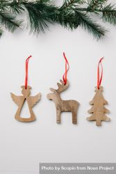 Christmas wooden cutout ornament on light background 5638P4
