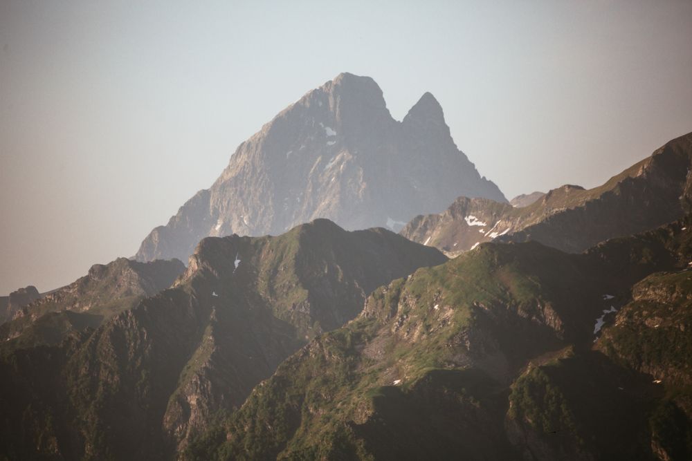 Majestic mountains range in clouds
