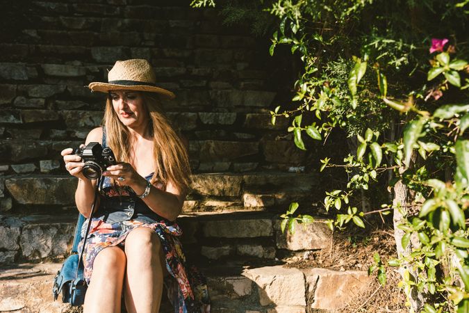 Woman with photo camera on street