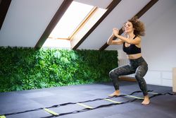 Woman working out in attic