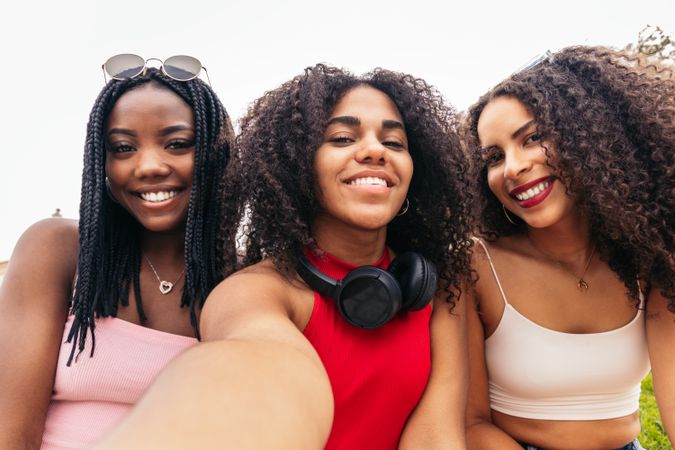 Young Friends Enjoying Summer Together and taking selfies