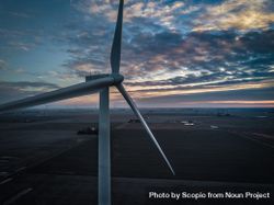 Close-up shot of wind turbine at sunset bYJOg0