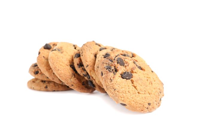 Tasty chocolate chip cookies isolated on studio background. Sweet biscuits